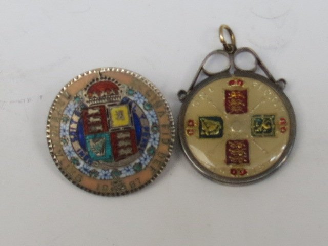 A Queen Victoria 1887 half crown, enamelled and: A Queen Victoria 1887 half crown, enamelled and converted to brooch AF; also King George V 1918 florin, enamelled and converted to pendant by silver clasp. 1oz.