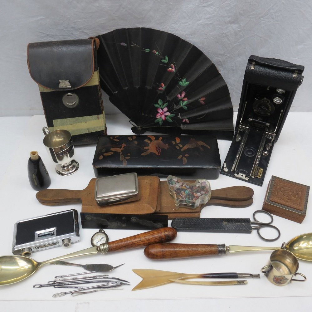 A collection of curiosities, including Kodak bellows: A collection of curiosities, including Kodak bellows camera, two pairs Scotch hands, black lacquer glove box and contents, a Tewkesbury tyg, Japanese fan, small powder horn etc.