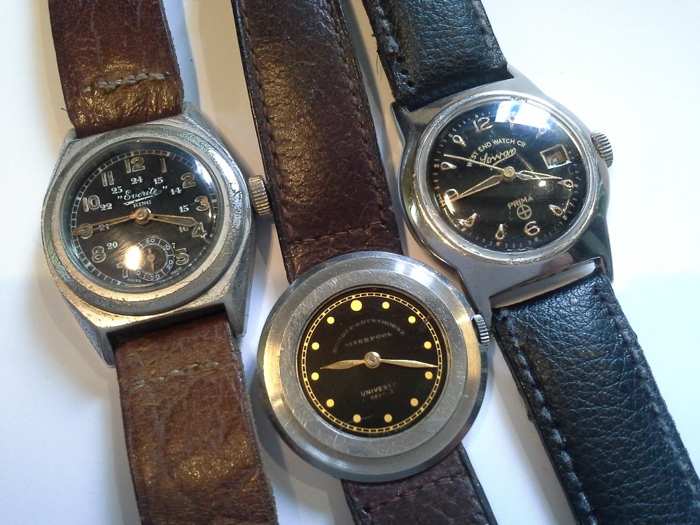A Universal Geneve steel cased watch marketed by: A Universal Geneve steel cased watch marketed by Boodle & Dunthorne of Liverpool. Also a West End Watch Co; Sowar, Prima and a further Everite King watch with military style dial and hands. All upon l