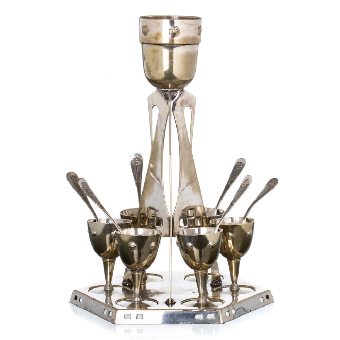 WMF - Art Nouveau / Jugendstil Egg Cruet: In silvered metal, flat decoration with castings and with relieved circles. Marked on the base (1880-1925). Dim.: 28.5 cm.