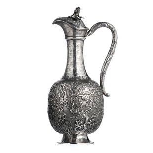 Chinese Silver Plum Blossom Wine Ewer, 19thC: Chinese silver from the second half of the 19th century, marked 850, goldsmith "CW", Cumwo, from Hong Kong, and with ideogram. Relieved chased decoration with plant motifs, log-shaped pommel. Signs of