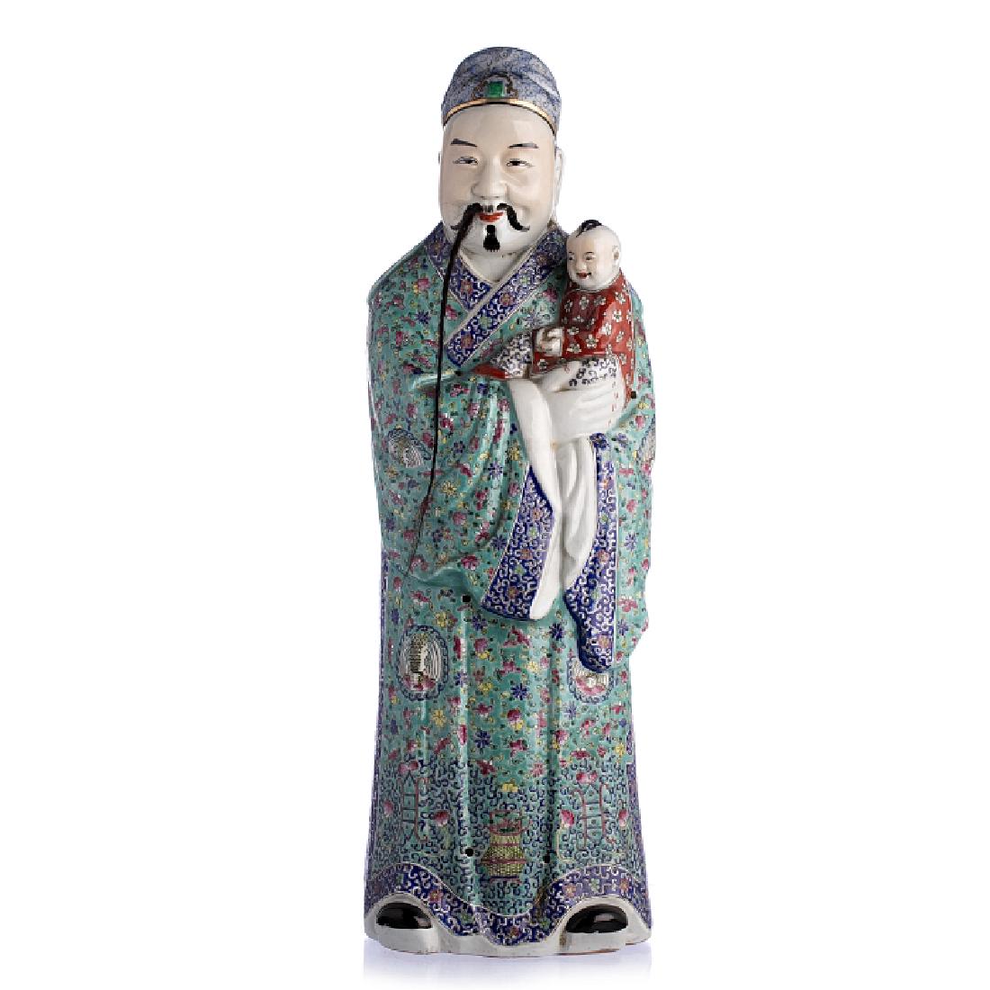 Immortal with a boy in Chinese porcelain, Guangxu: China, Guangxu period, moulded porcelain, polychrome gold decoration, beard in horsehair. Signs of wear. Mark on the bottom. Dim.: 63.5 cm.