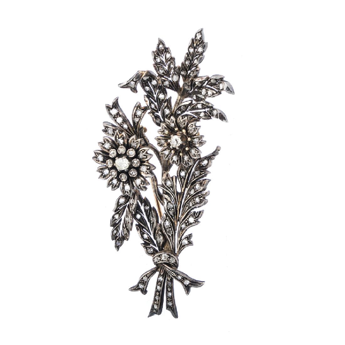 'Bough' silver and gold trembling pin brooch studded: Silver and gold; dog assay markings (1938-1984), studded with rose, old, cushion cut diamonds, of approx. 0.97 ct. Approx. Weight: 32 g. Dim.: 9 cm.