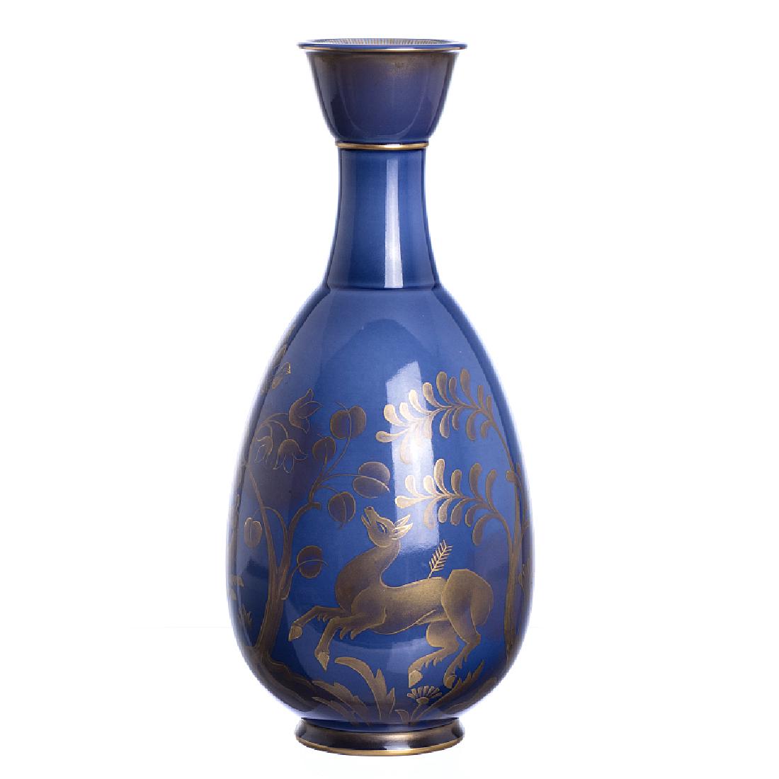 MARCEL PRUNIER (1894-1988) - Sevres Art Deco porcelain: Sevres French porcelain, Art Deco, polychrome decoration and gold with animals between flowers, signed and marked at the base. Dim .: 33.5cm.