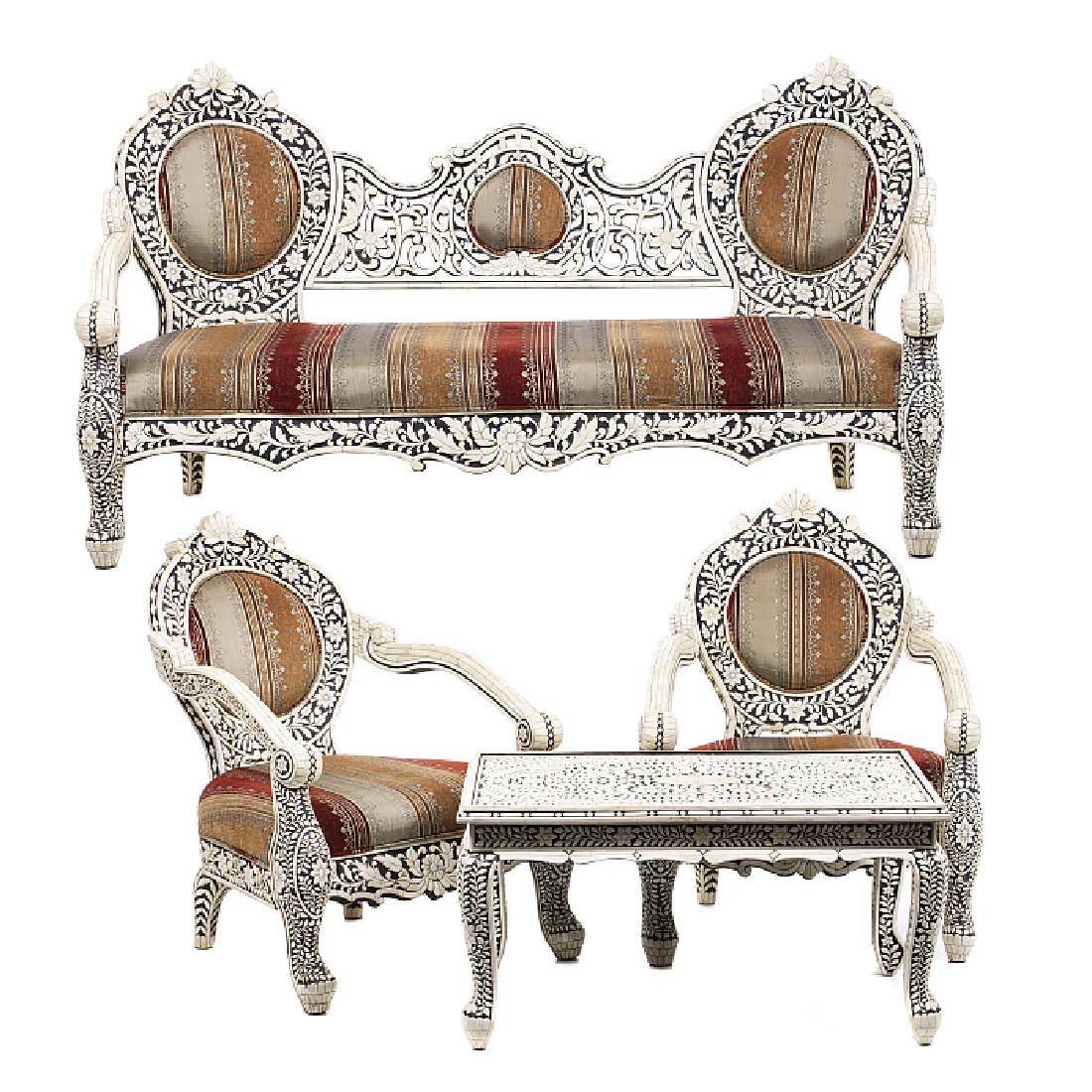 Three Indian sofas, tables: India, 19th century, carved wood, covered in bone plaques. Signs of wear, slight faults. Dim. Of the settees: 96x180x70 cm; table: 47.5x92x67 cm.