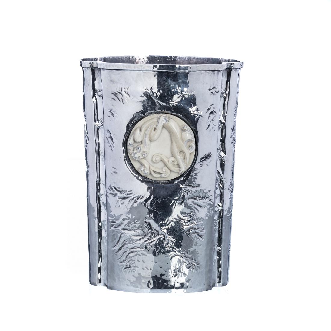 MANUEL ALCINO â€” Silver vase: Portuguese silver, a 925 eagle assay marking (post-1985), a goldsmith marking, Manuel Alcino & Filhos (reg.1986), a relieved, hammered decoration, with an Oriental medallion in carved bone. Approx. we