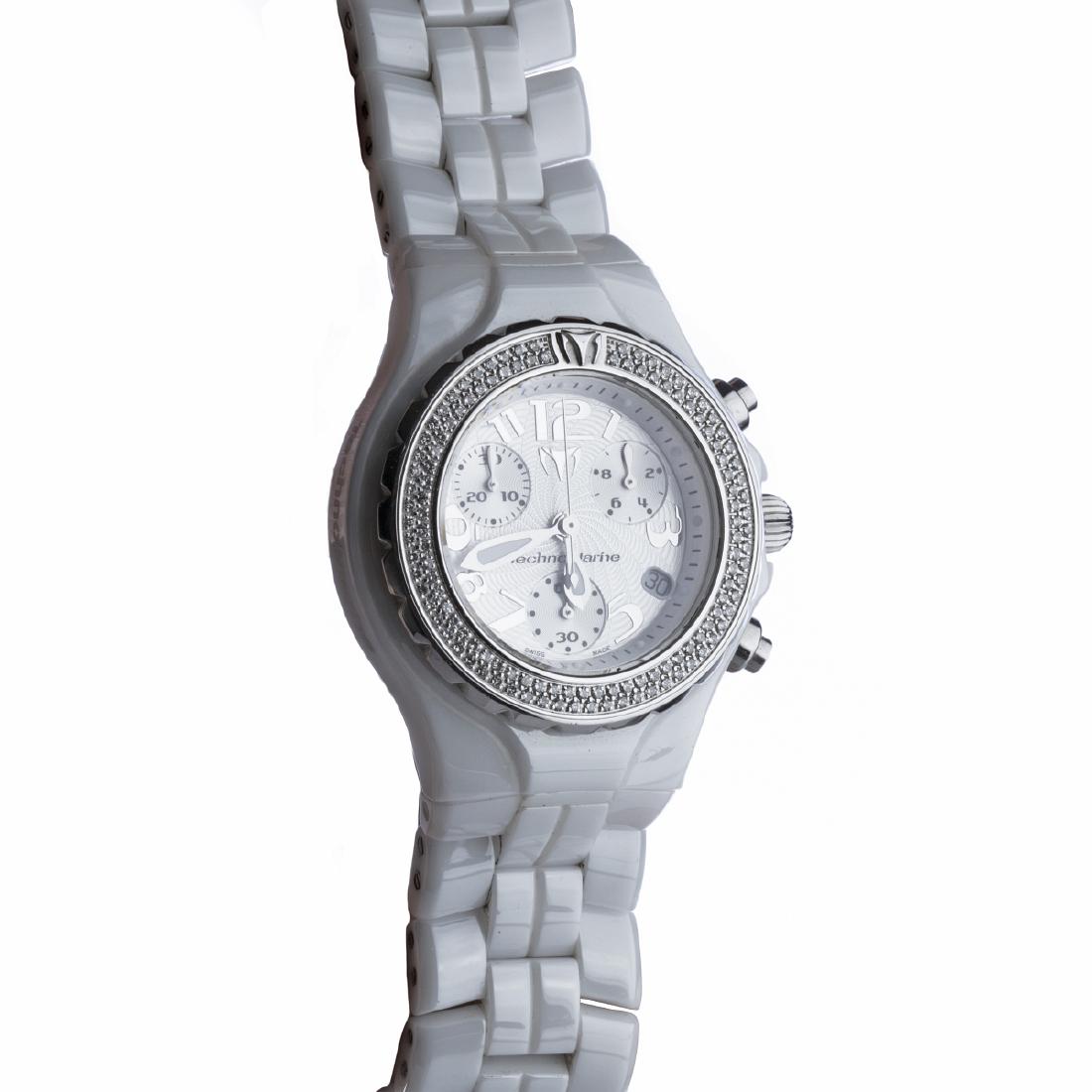 TECHNOMARINE - TechnoDiamond watch: Wrist watch in ceramics and steel, quartz, sapphire glass, numbered DTC02319, white bracelet, luminescent dials, case studded with brilliants. It is working, it has a case. Marked. Dimension: 9 cm.
