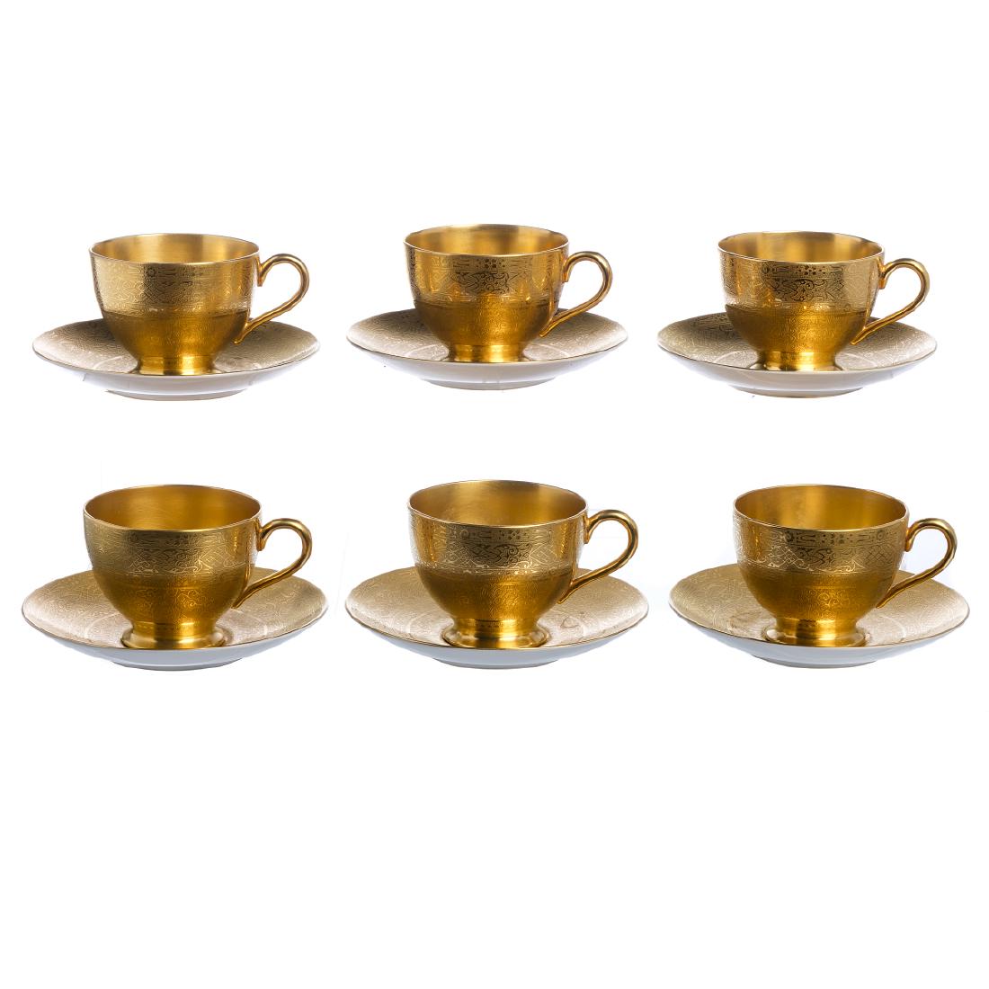 WARTSKI - Six teacups in Minton porcelain: WARTSKI - Six teacups in Minton porcelain English porcelain, rich geometrical decoration in relieved gold. Wartski London edition. Marked and signed. Dim.teacups: 10.7 cm, saucers: 14.5 cm.