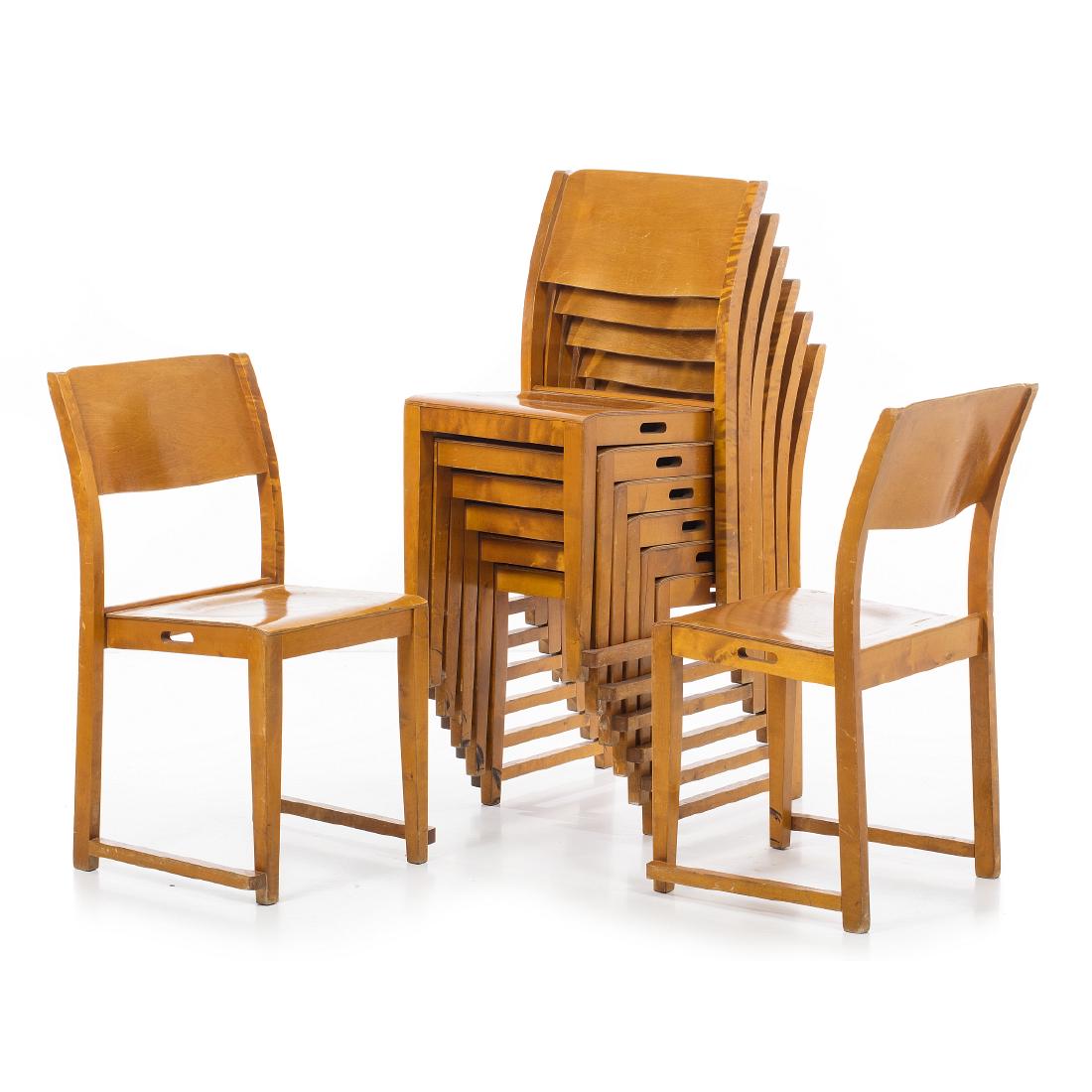 SVEN MARKELIUS (1889-1972) - Eight chairs 'Orchestra': Sweden, c.1960, manufacture of Bodafors, creation of 1932, in beech, with side handles, stackable. Signs of use. Dim .: 84x46x41cm.