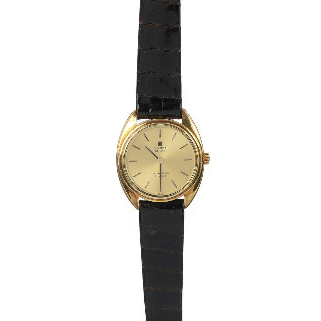 UNIVERSAL GENEVE - Golden Shadow Watch NOS: Wristwatch New Old Stock, 18K gold case, Helvetia assay marking, quartz, ref.174600/3555084, hands, hours and dial in gold, brown leather bracelet with warranty certificate. Marked. Dial dim.:3cm.