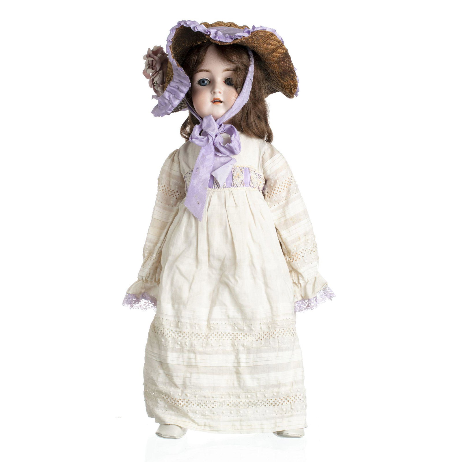 German bisque doll, Bruno Schmidt: German doll, bisque head, jointed wood arms and legs, and composition body, antique clothing, human hair wig, marked 'BSW' inside heart. Signs of use. Dim .: 58 cm.