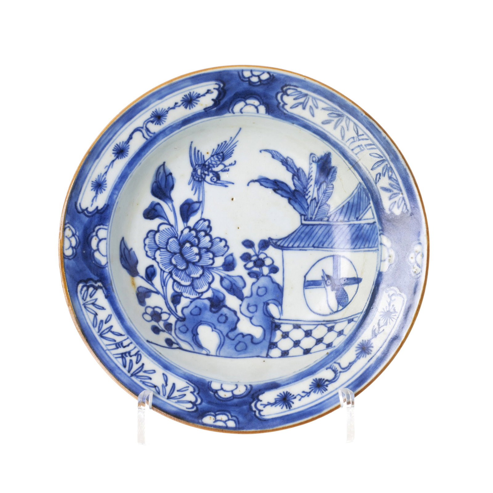 Chinese porcelain bowl, Ming: China, Ming dynasty, Wanli period, blue decoration with bird in landscape, flap with botanical reserves and iron rouge, Signs of use. Dim: 16cm