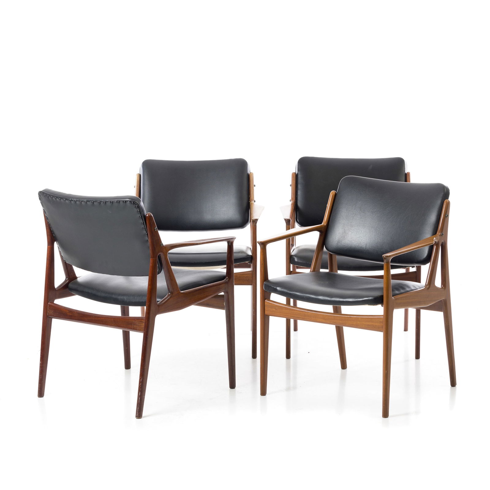 ARNE VODDER (1926-2009) - Four 'Ella' Armchairs: Denmark, c.1960, model 'Ella', made by Vamo, in teak upholstered in black faux leather. Signs of use.. Dim.:80x73x57cm.