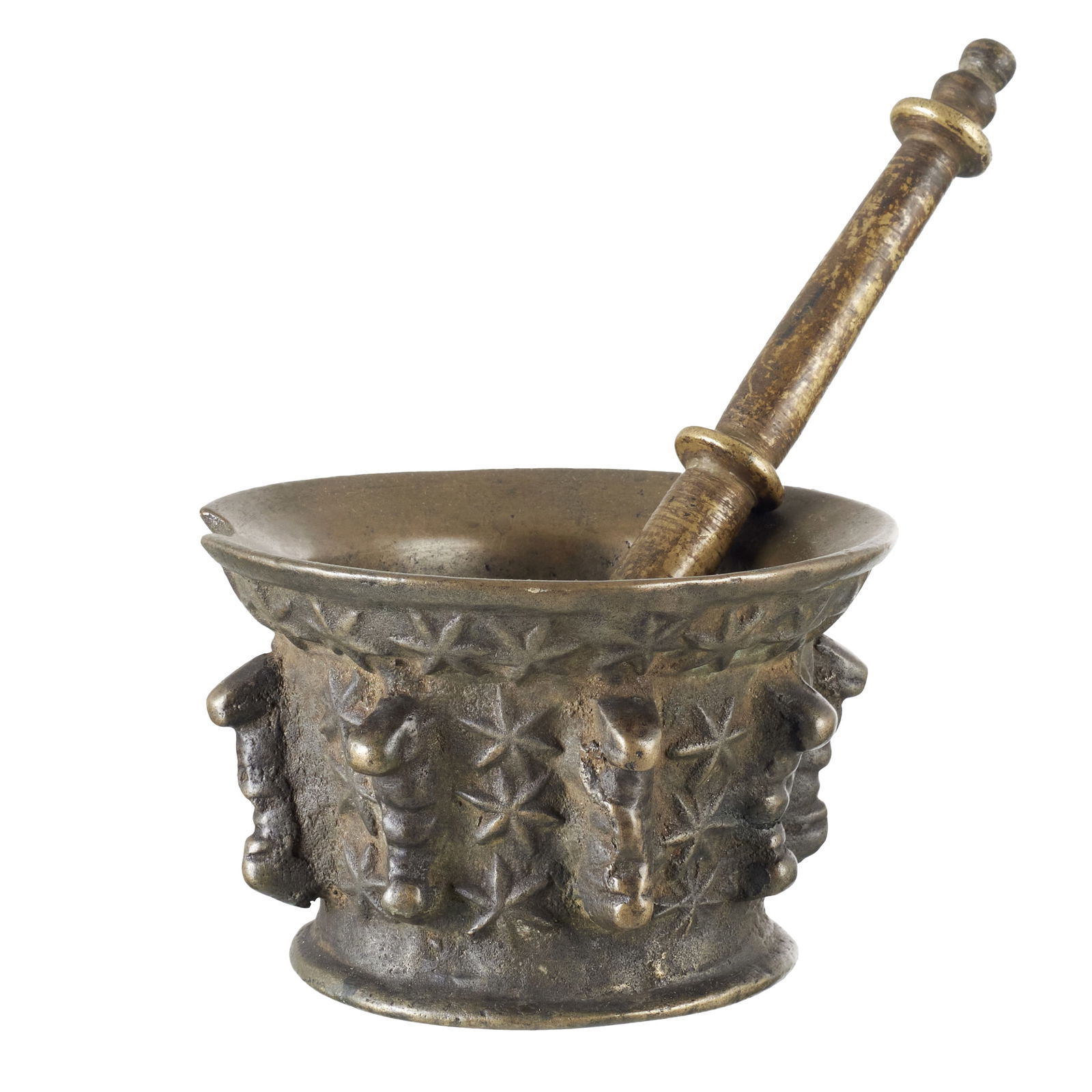 Spanish bronze mortar and pestle: Spain, 17th/18th century, patinated bronze, relief decoration of stars and fins, with pestle. Minor chips and defects. Dim.: 13cm (mortar diameter); 20.5cm (pestle).