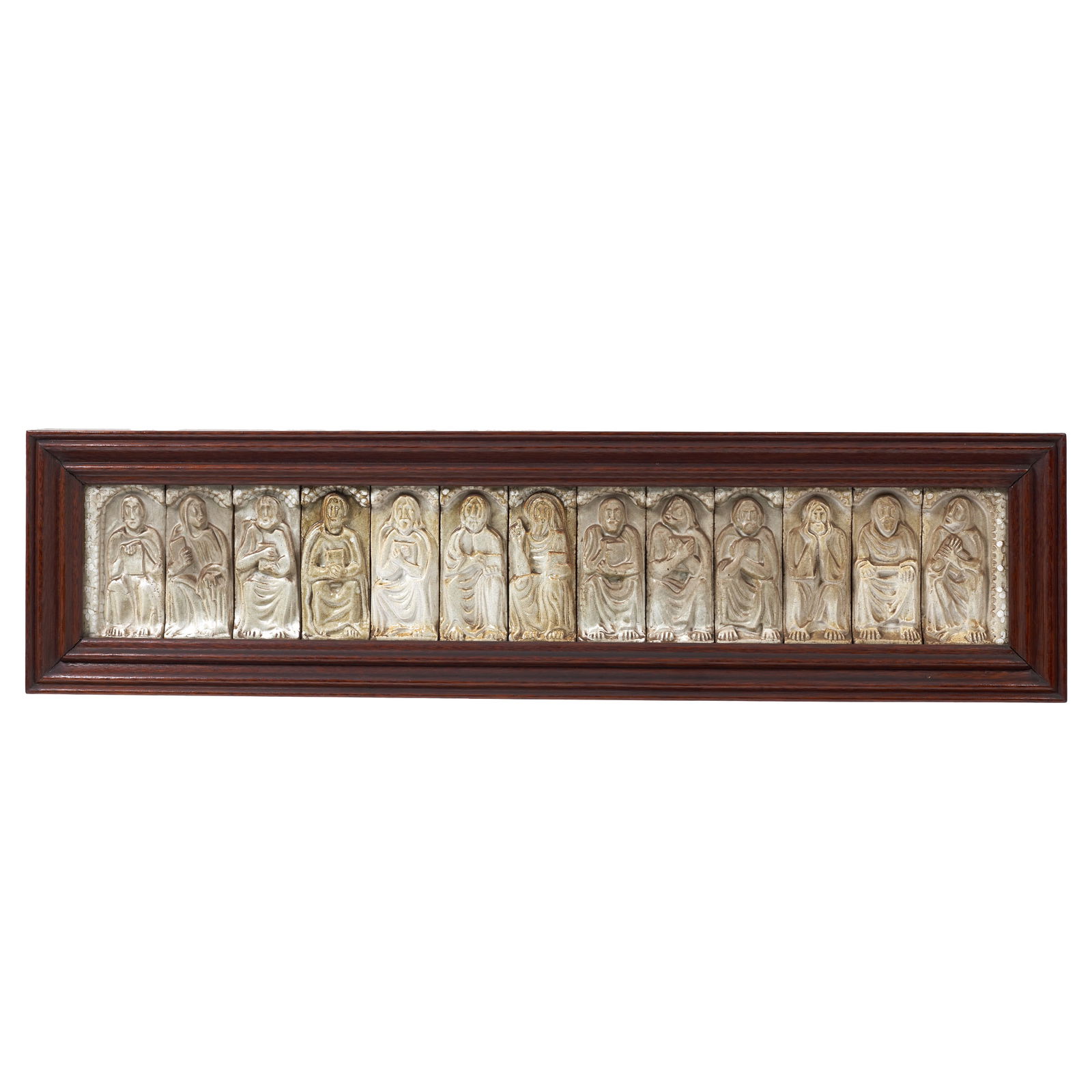 PORTUGUESE SCHOOL, c.1960 - Tile panel 'Christ with the 12 Apostles': Porcelain stoneware, 13 relief tile panels, monochrome white decoration, representing Christ and the apostles. Signs of use. Dimensions: 128.5x32.5cm (with frame); 112x19cm (panel).