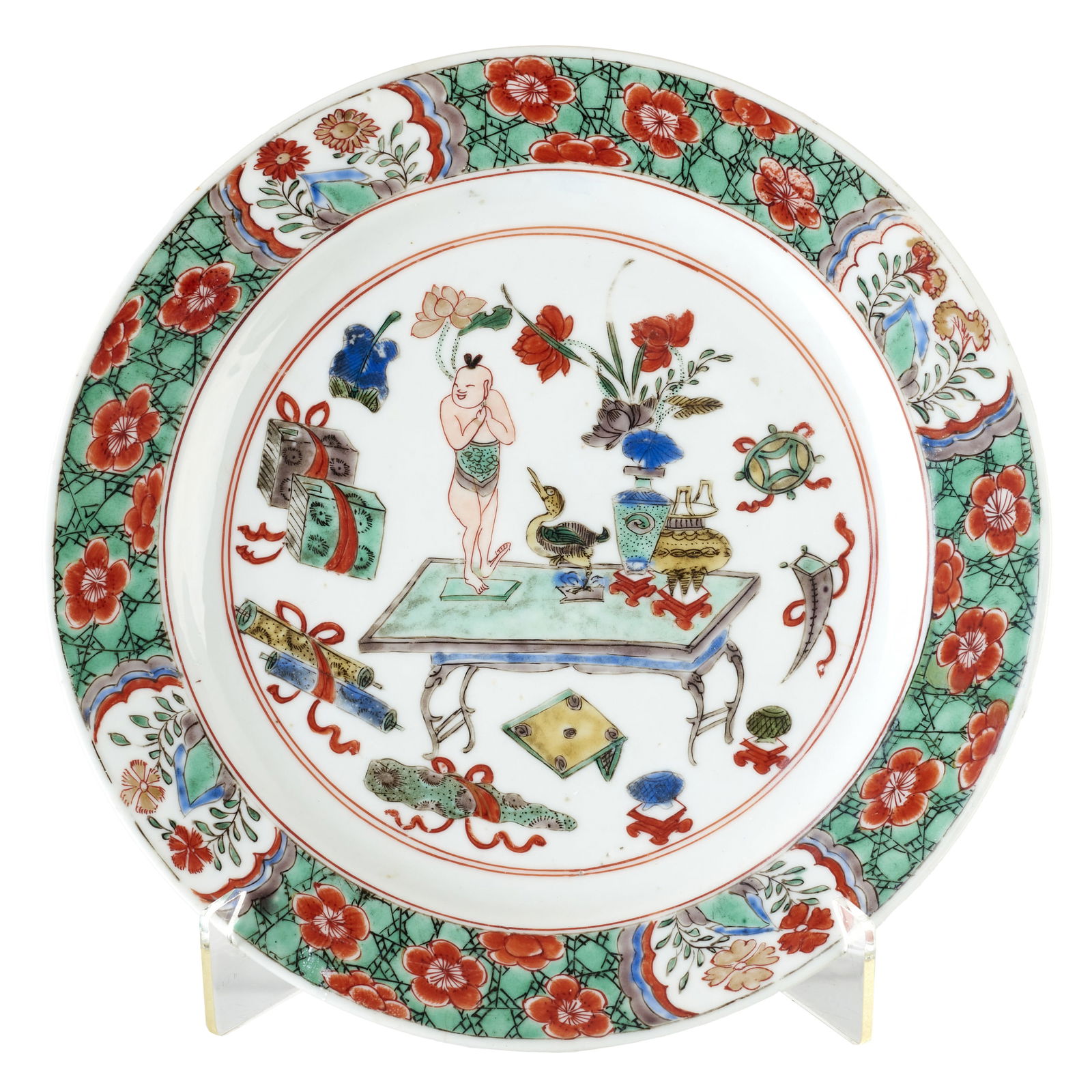 Chinese porcelain Daoist plate, Kangxi: China, Kangxi, porcelain, gilt and polychrome famille verte decoration, central reserve depicting objects on a table surrounded by auspicious symbols, rim with floral motifs. Marked on the reverse. Si