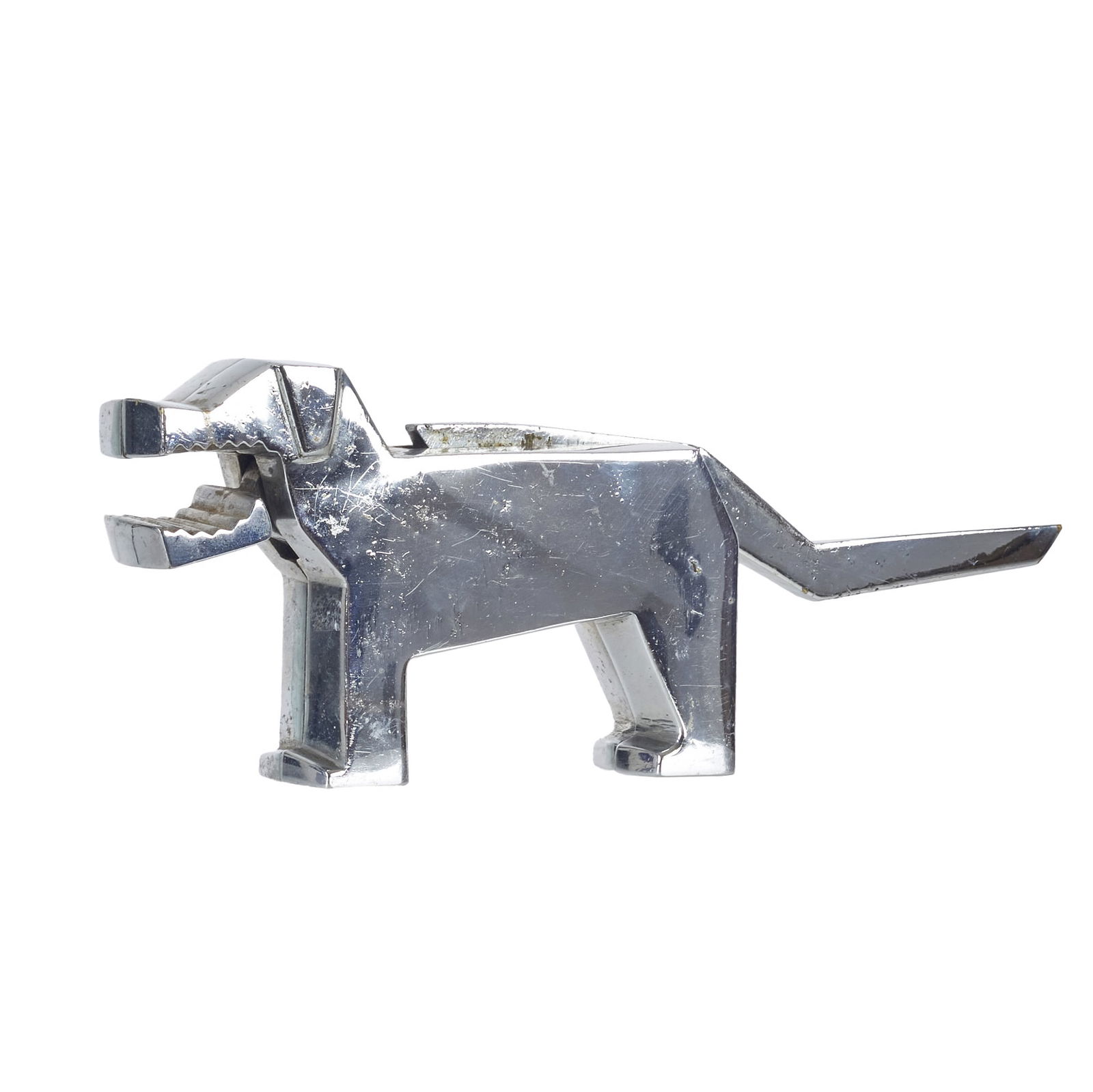 Art Deco 'Dog' nutcracker: C.1930, chrome-plated metal nutcracker in the shape of a dog. Signs of wear and defects. Dim.: 9.5 x 25.5 x 3.5 cm.