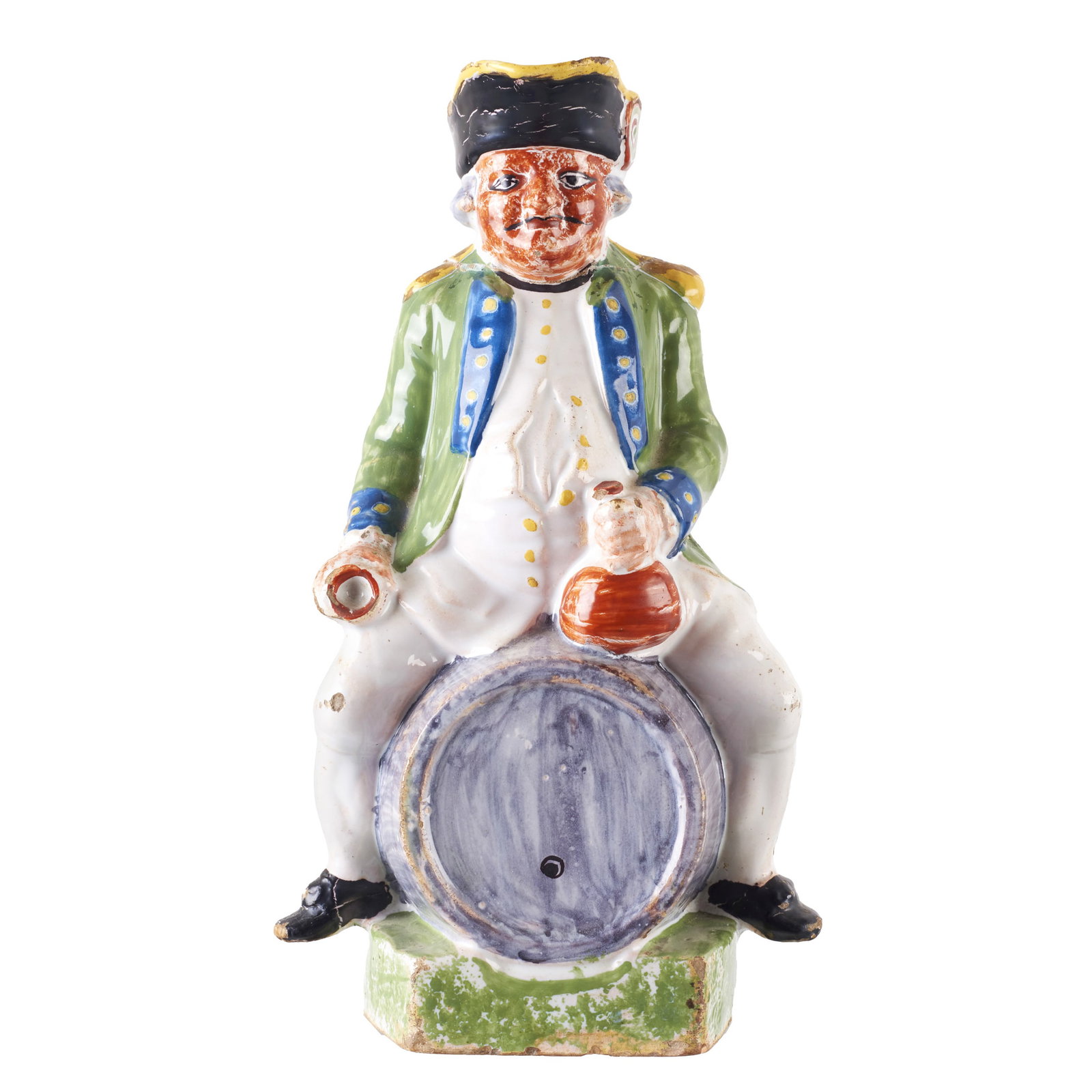 Earthenware Toby Jug: France, 18th century, earthenware with polychrome glazed decoration, depicting a figure wearing a tricorn hat seated on a barrel, holding a bottle and a glass. Minor flaws, hair, repaired. Height: 28