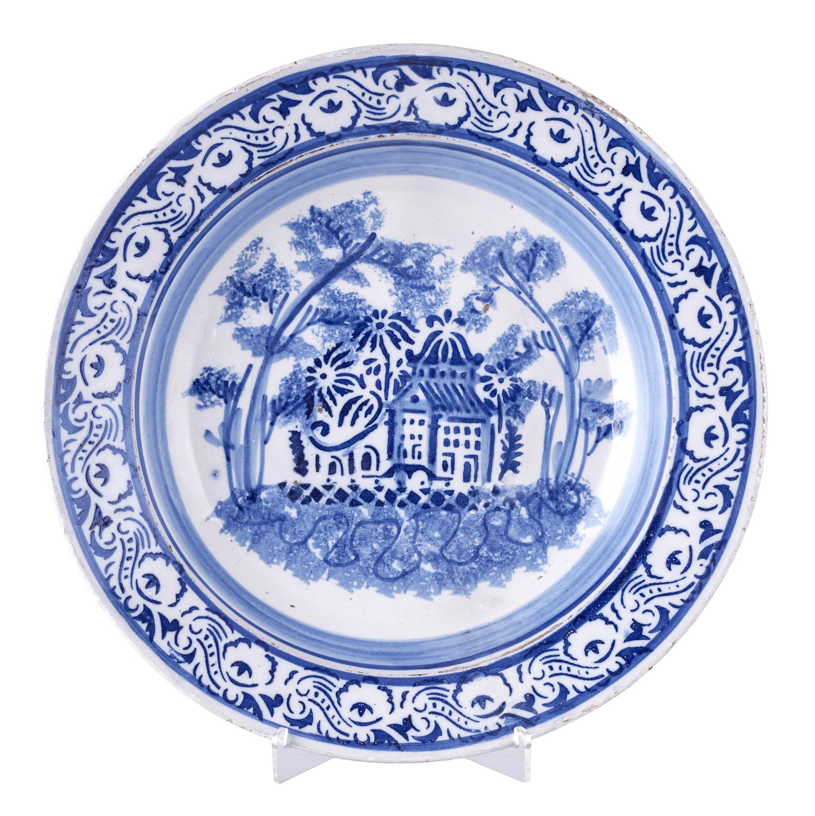 'Casario' Portuguese earthenware plate: Portuguese earthenware, 19th century, decorated in blue with plant motifs and house. Signs of use, minor chips. Dim.: 34.5cm.