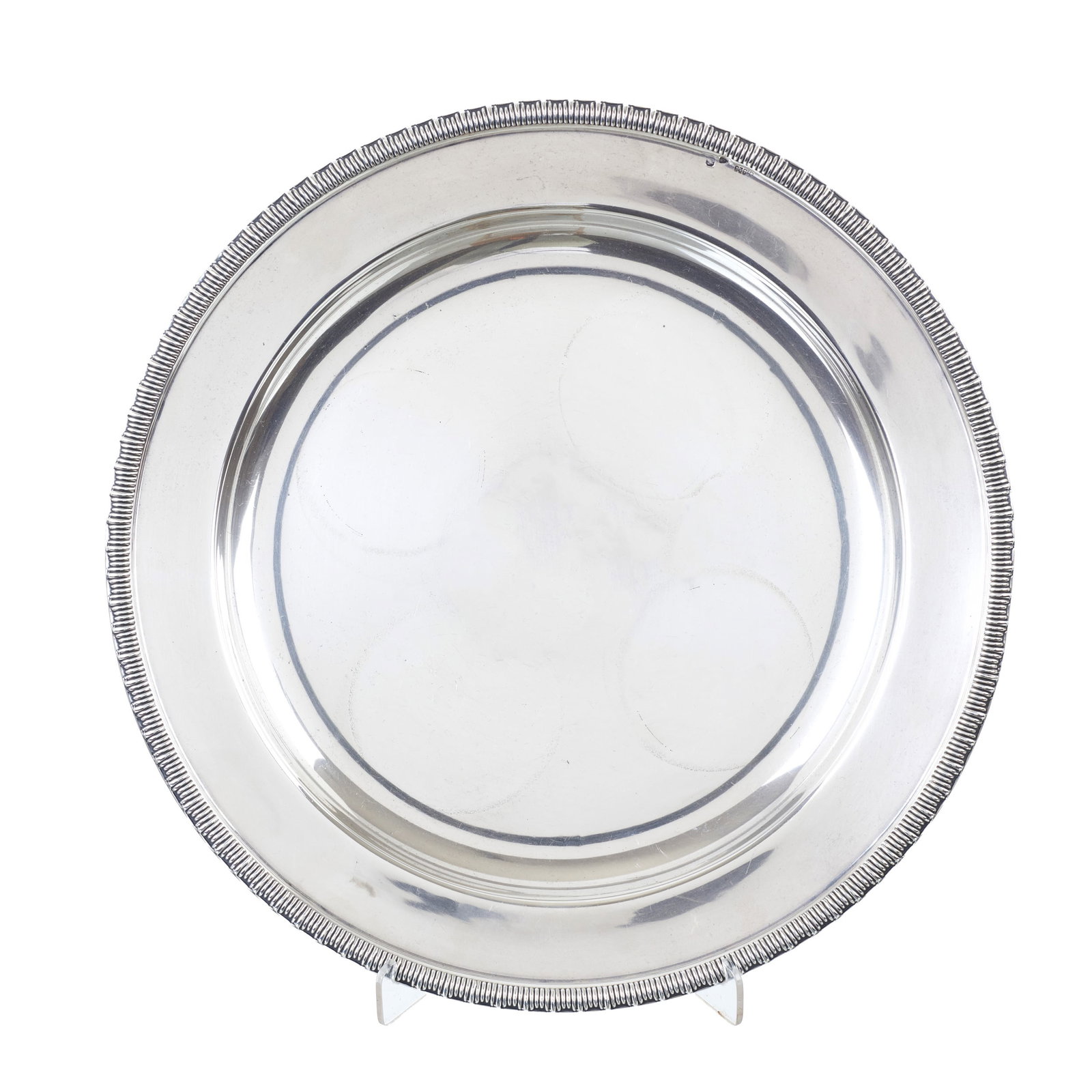Silver Charger: Portuguese silver, 925 eagle hallmark (post-1985), silversmith?s mark of Ferreira Marques & Irmao Ld? (reg. 1974); raised fluted rim. Signs of use. Approx. weight: 560g. Dim.: 32cm.