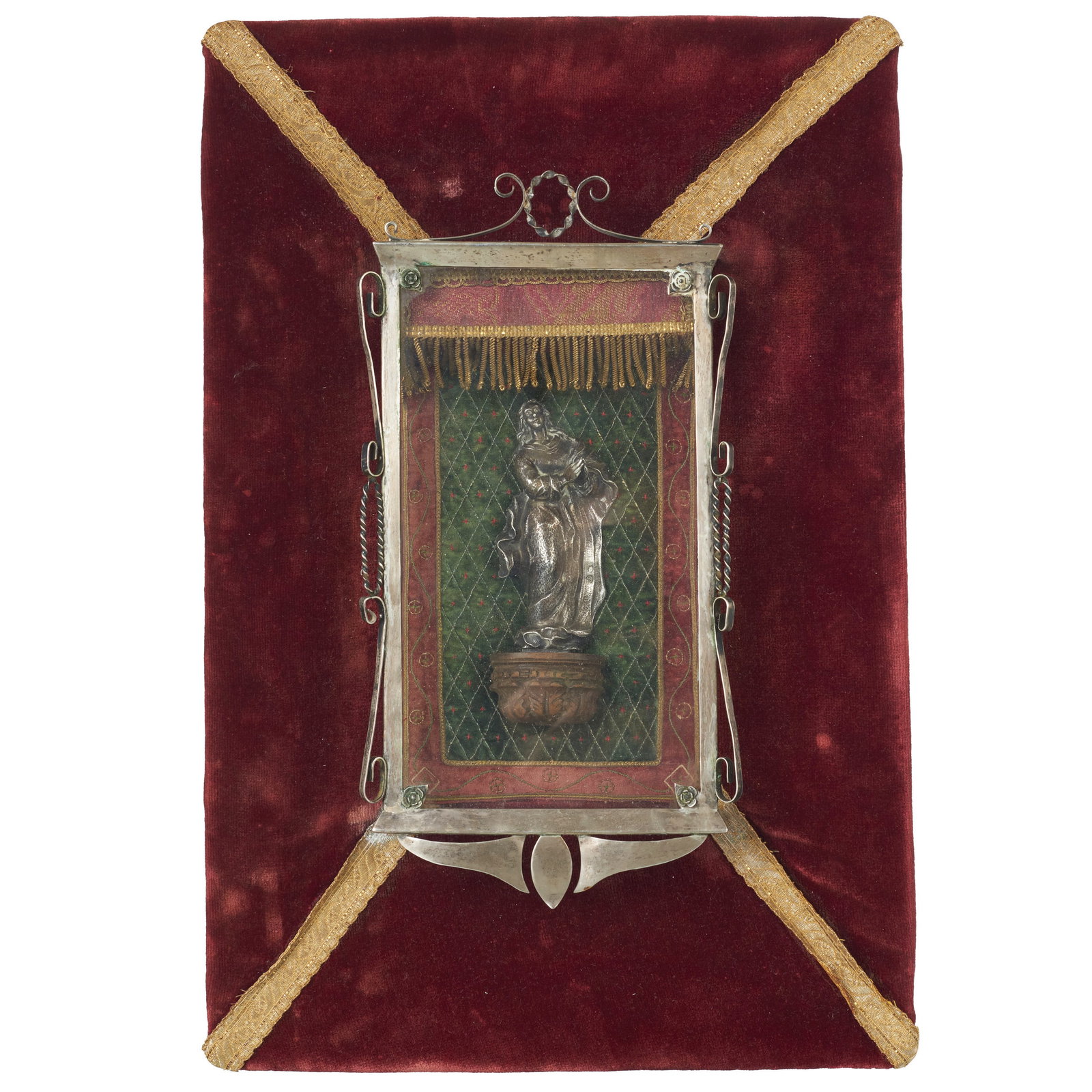 Spanish silver Madonna, 18th/19th century: Silver with faded contrast, silversmith's mark ?SG?; raised decoration depicting Our Lady on a carved wooden base; glazed niche decorated with scrolls; velvet background with gold thread. Signs of