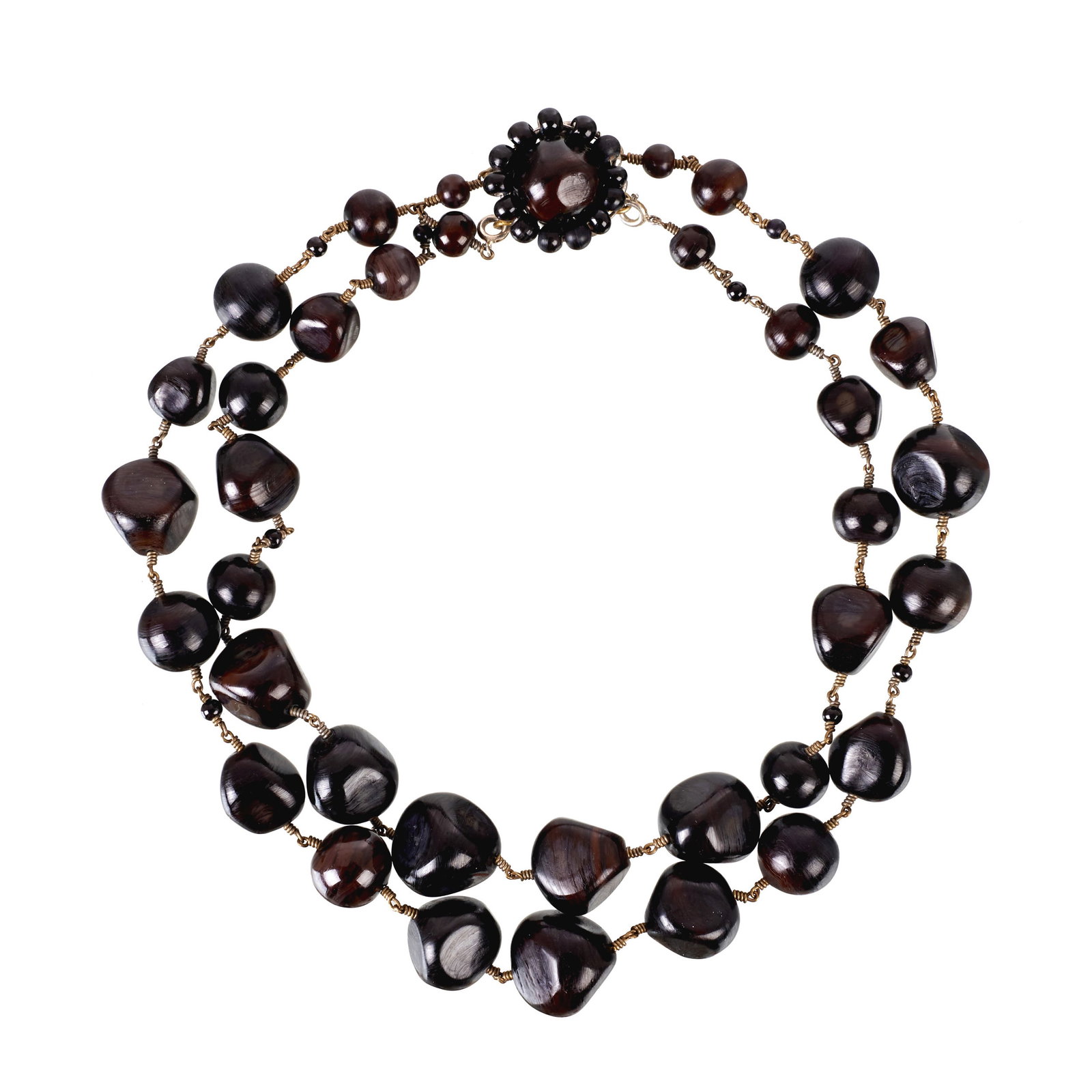 GERARD DAREL - 'Jackie Kennedy' Necklace: a la lamp' glass beads with a flower-shaped clasp; 'Jackie Kennedy' model sold by Sotheby's in New York, 1996. Original box. Signs of use. Dim. (closed): 20cm.