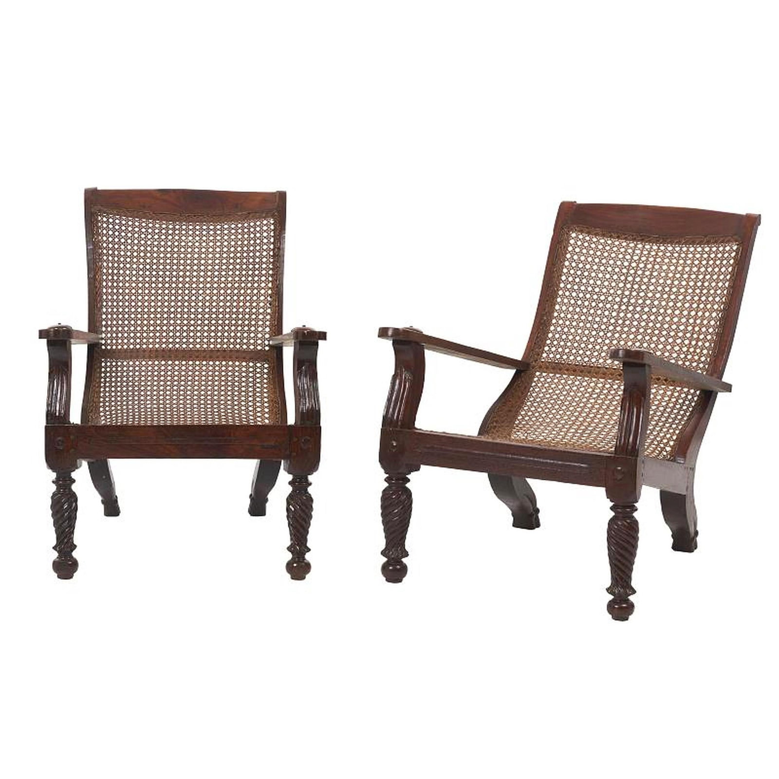 Pair of English cane armchairs: English, late 19th Century, carved mahogany, legs with twisted turning and claw feet, seat and back in cane. Signs of use. Dim.: 88x57x102cm.