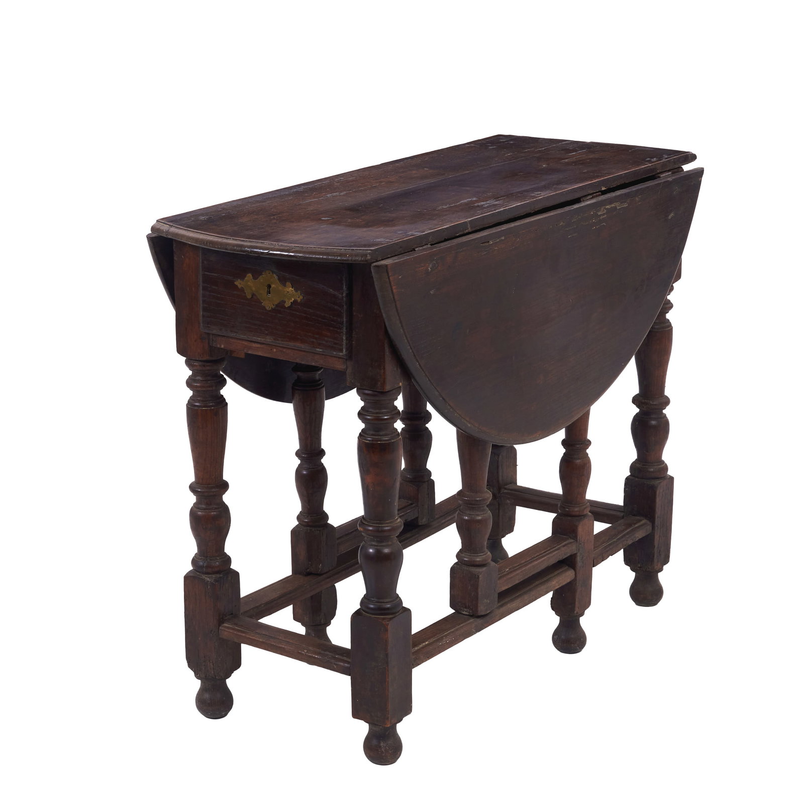 Gateleg side table: Portugal, 18th century, in chestnut, with na oval top with folding sides and turned hinged legs; two drawers, brass hardware. Signs of use. Dim.: 79x102x43cm (closed); 79x102x110cm (open).