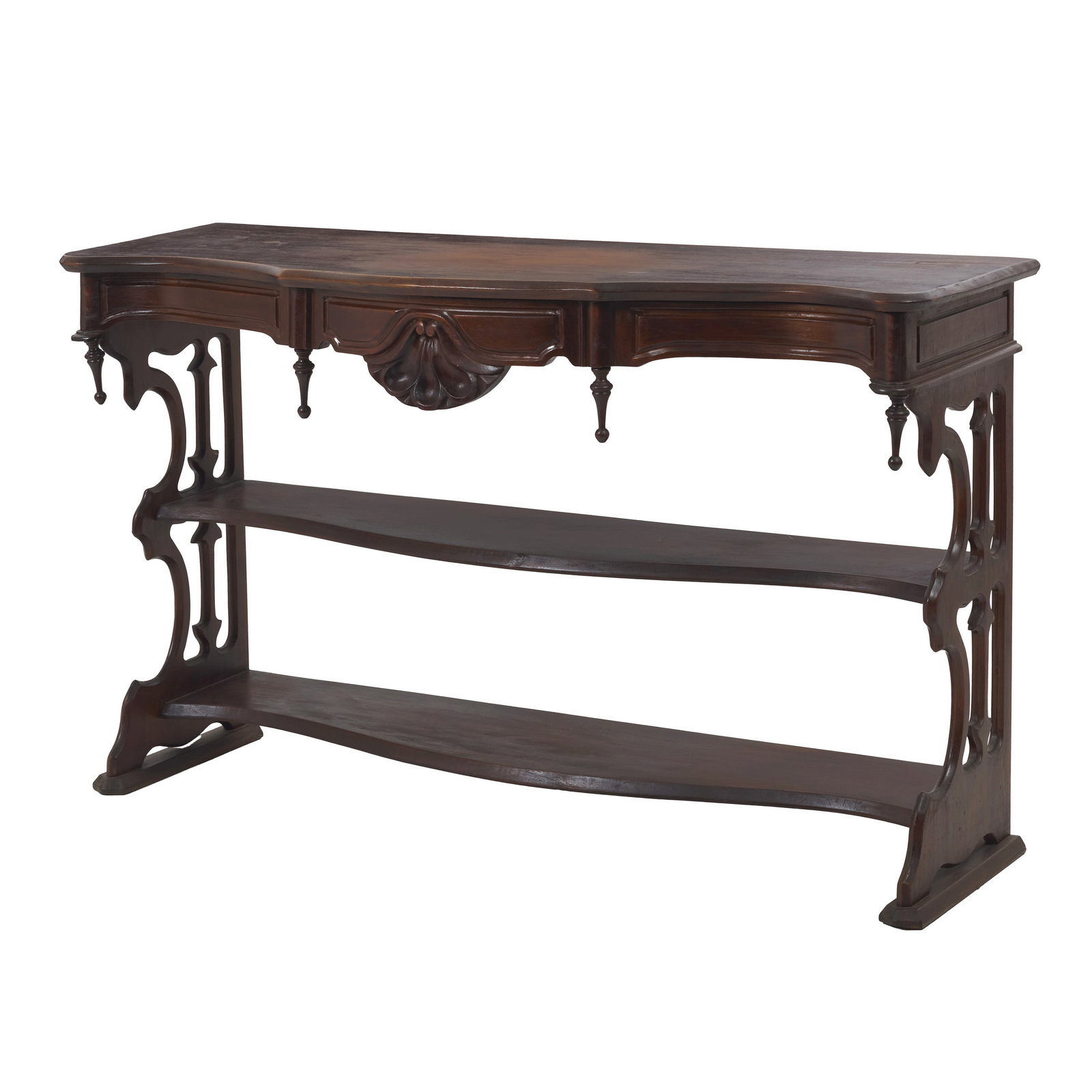 Romantic Console Table: Portugal, 19th century, in mahogany; carved and scalloped waist, decorated with a central scroll motif and turned finials; scalloped and openwork sides connected by two shelves. Signs of use. Dim.: