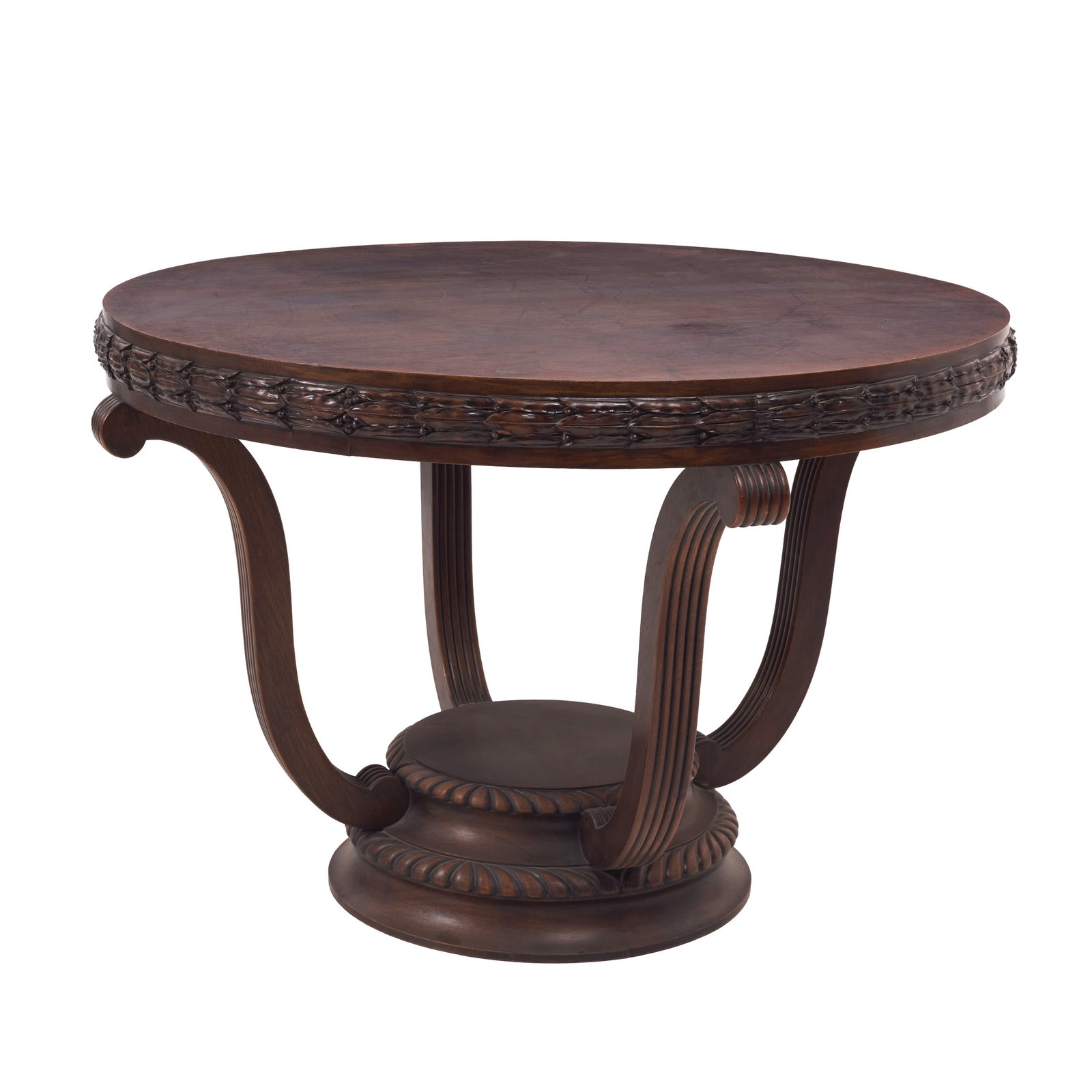 Round coffee table: Portugal, 19th/20th century, carved walnut; round top with a frieze featuring raised decoration; four curved, fluted legs in a volute style, resting on a circular, rounded base. Signs of use. Dim.: