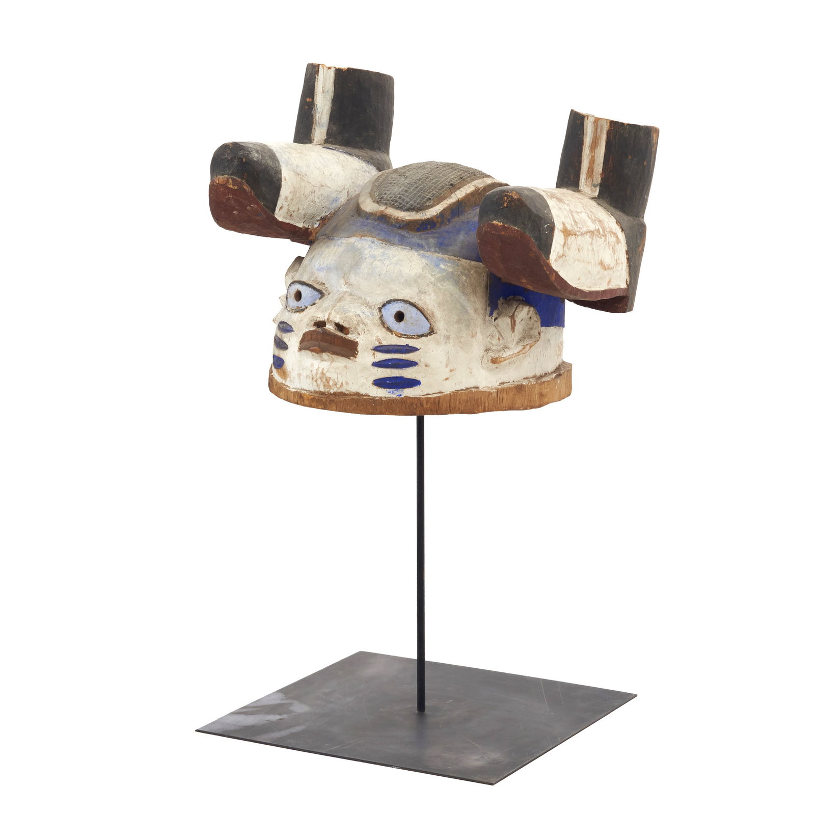 YORUBA - Gelede mask: Nigeria, Yoruba, 1st quarter of 20th century, carved and polychromed wood with a painted iron base at the rear. Signs of useand minor flaws. Ex- Fernando Moncada. Dim.: 23x30x28cm.