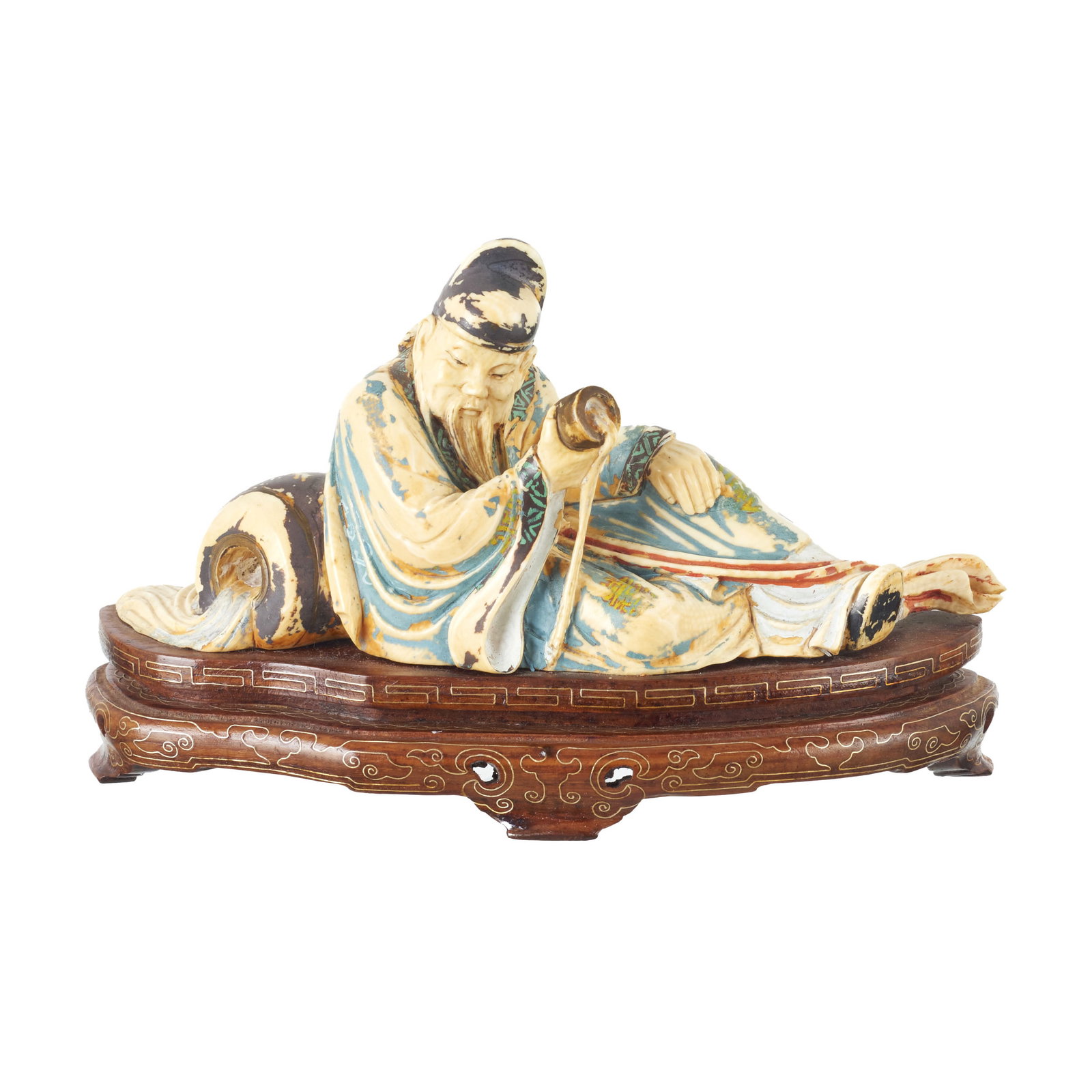 Chinese ivory sculpture of a Scholar: China, Minguo, carved ivory sculpture depicting a seated elderly man, traces of polychromy; carved wooden base with inlaid silver decoration. Signs of use. Dim.: 18cm.