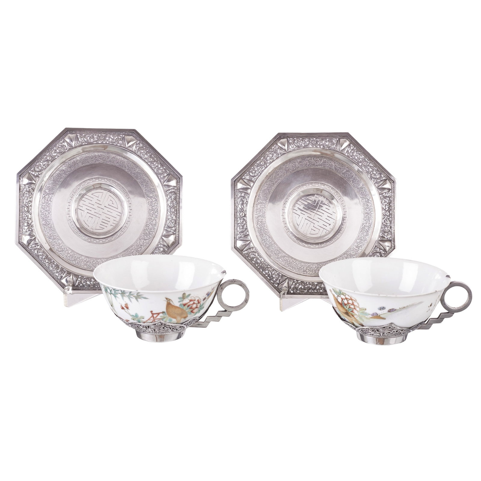 Chinese porcelain and silver tea set: China, Minguo, polychrome enamel decoration in the pink family with gold depicting a bird amidst floral motifs; frame and plates in Chinese silver, engraved and openwork with a figure, a dragon and sc