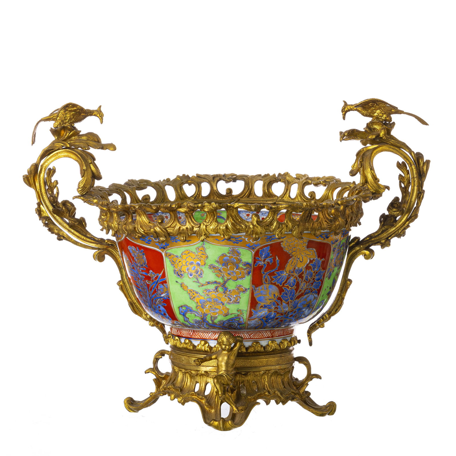 Chinese porcelain punch bowl with gilded bronze mount, Kangxi: China, Kangxi period, polychrome decoration with enamels and gold, Imari style, featuring floral motifs. Fitted with a French bronze mount and handles, 19th century, with raised decoration featuring p