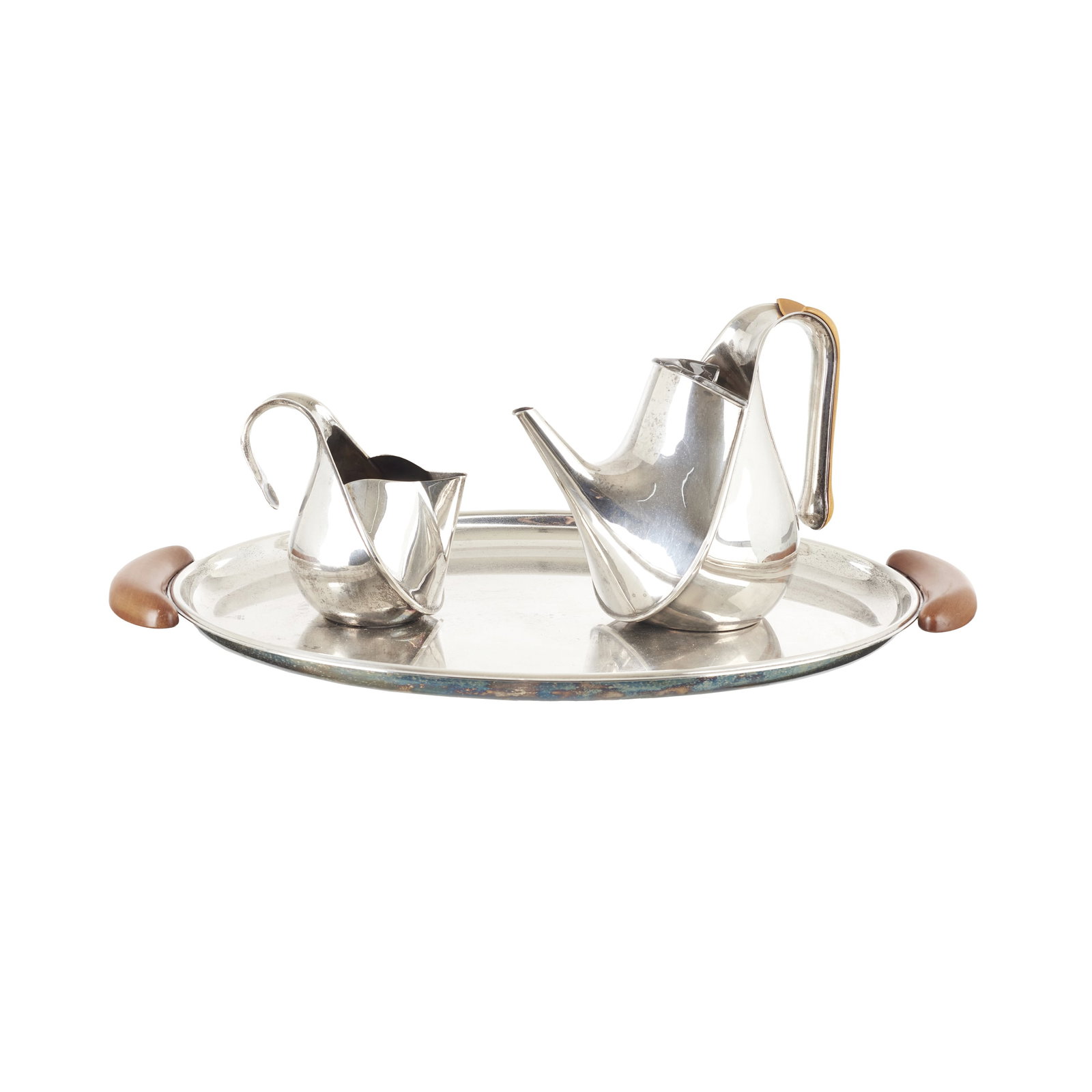 OSCAR TUSQUETS (b. 1941) - Tea set 'Oronda': Italy, c. 1983, designed by Oscar Tusquets for Alessi; in silver metal, with wooden handles and a glass lid. Signs of use, incomplete. Dim.: 12.5 to 50cm.