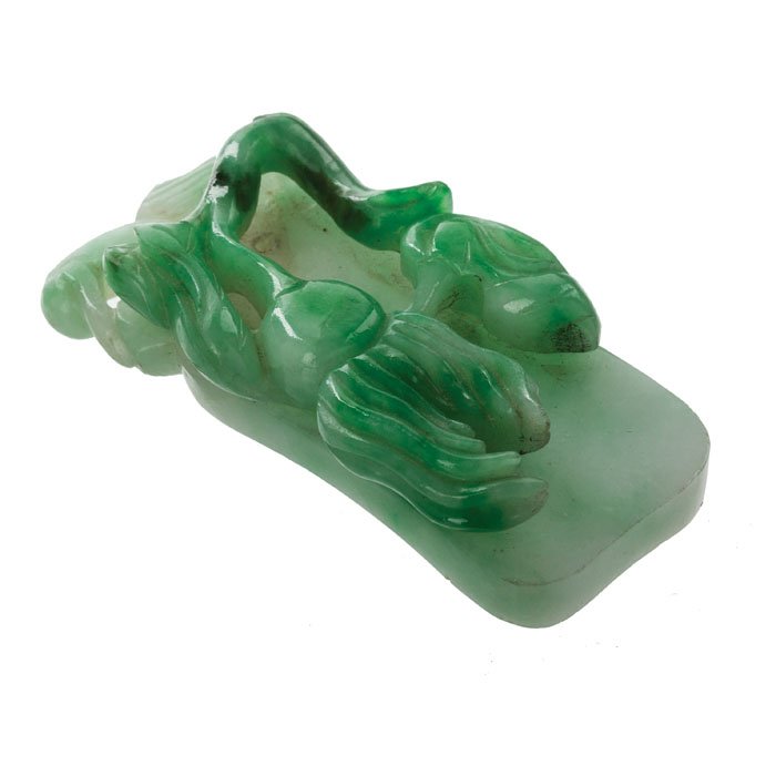 Chinese pendant in jadeite: China 20th Century, period Minguo / Republic, jadeite carved with vegetal decoration. Dim.: 5.1 cm.