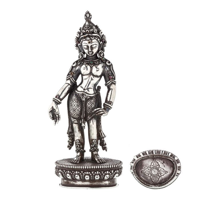 Bodhisattva Tara in silver: Tibet / Nepal, mid 20th Century, silver and precious stones, Tara standing in mudra, wearing tiara. Brand Vajra base. Approx.: 609grs. Dim.: 17.5 cm.