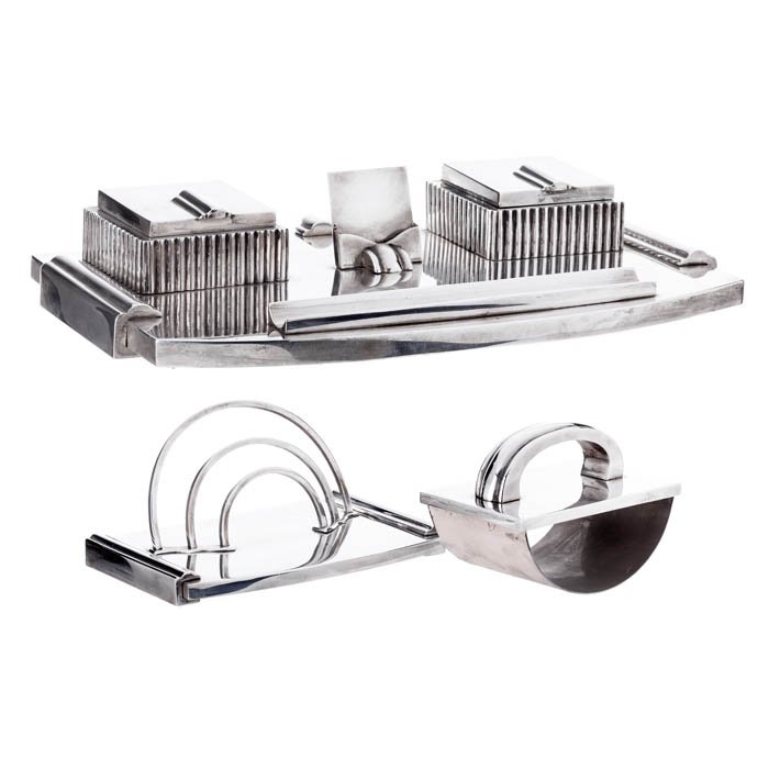 Art Deco desk set in silver: Portuguese silver, eagle contrast, desk with inkpots, blotting paper and envelope holder. Approximate weight:2827grs (silver). Dim.:from 15,5cm to 34,5cm.