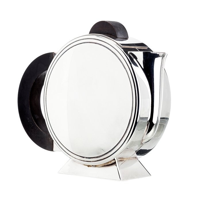 CHRISTOFLE, PARIS - Art deco teapot: Silvered metal, circular shape, art deco, handles in exotic wood. Marked. Signs of wear. Dim.:20cm.
