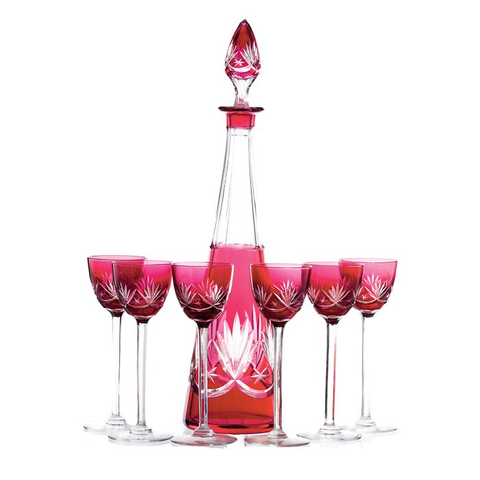 Bottle with ten chalices in crystal: Set in bicolour crystal, lapidated decoration. Dim.:17 and 41.5cm.