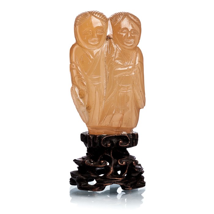 Pair of Chinese divinities in hard stone, Minguo: China, 20th century, Minguo, sculpture in hard stone, representing gods of peace and harmony, base in carved and cast wood. Dim.: 8.5 cm.
