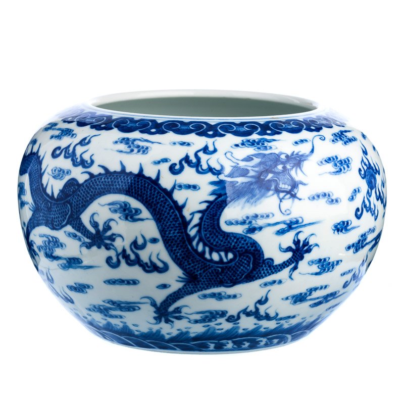 Cachepot 'dragon' in Chinese porcelain, Guangxu: China, 19th century, Guangxu period, blue decoration under the glaze, dragon amoung clouds. Apocryphal mark on the base. Small hairline on the back. Dim.:25cm.