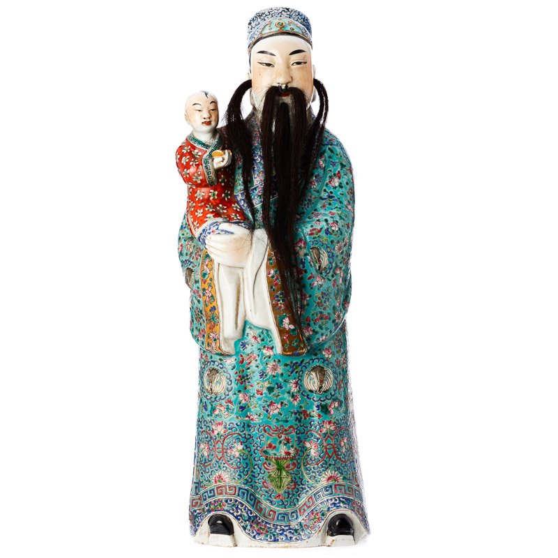 Immortal with a child in Chinese porcelain: China, moulded porcelain, gold and polychrome decoration, figure with rich and floral vests holding a child, beard and hair in horse mane. Marks on the bottom. Dim.:58cm.
