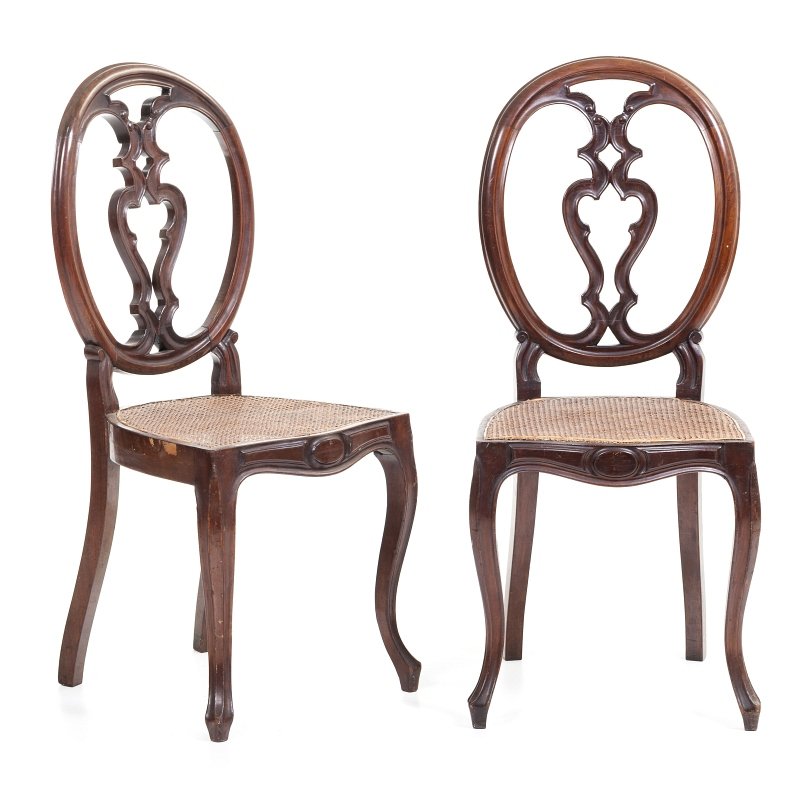 Pair of Romantic chairs: Pair of Portuguese chairs, 19th century, carved mahogany, canned seats. Small defects. Dim.:95,5x43x41cm.