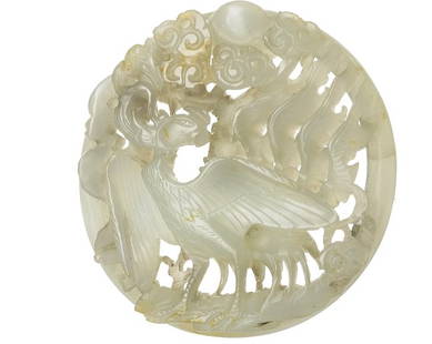 Large plaque in jade with phoenix, China, Minguo: Sculpture carved in white jade, Minguo period, with cast representation of a phoenix among flames, ball of fire and ruyi. Small fracture. Dim.:5,9cm.