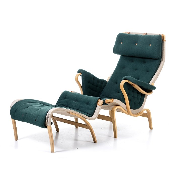 BRUNO MATHSSON (1907-1988) - Chair and footstool ': Sweden, c.1960, moulded beechwood, fabric upholstery, leather barrettes. Signs of wear. Dim.: 100x74x84cm.