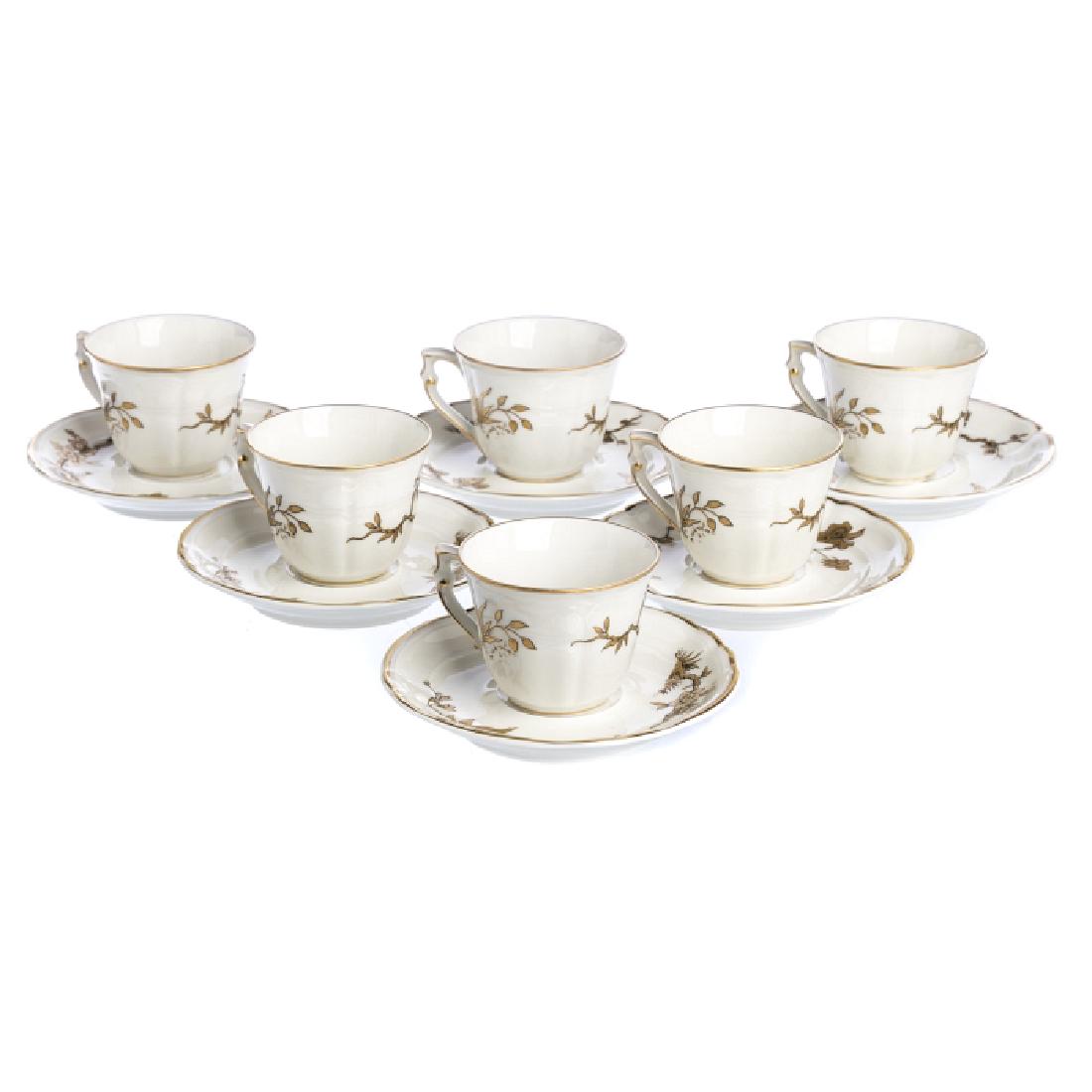 Six commemorative coffee cups in porcelain from Limoges: French porcelain from Bernardaud, Limoges, gold decoration, commemorative of Queen Elizabeth's visit to France in 1957, April, marked "B&CÂª Limoges France". Dim.: 11,3 cm.