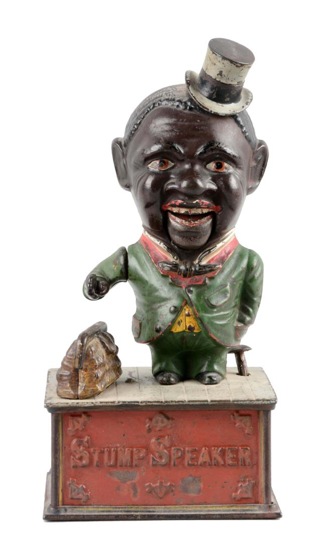 Shepard Hardware Stump Speaker Cast Iron Mechanical: Place a coin in the hand of the stump speaker and press the lever. He drops the coin in the satchel and his lower mouth bobs up and down. Repaint to sides and back. Top also appears repainted suggesti