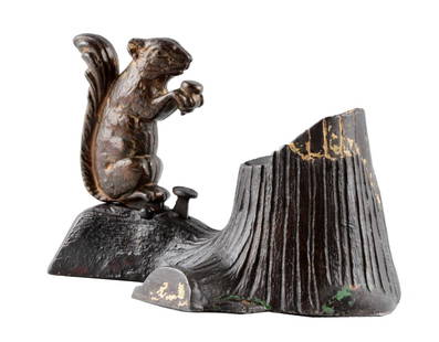 Squirrel And Tree Stump Mechanical Bank.: Mechanical Novelty Works. Designed by Robert E. Turnbull, patented 6/28/81. Place a coin in the squirrel's fore-paws, touch the spring and the squirrel bounds forward and throws the coin into the bank