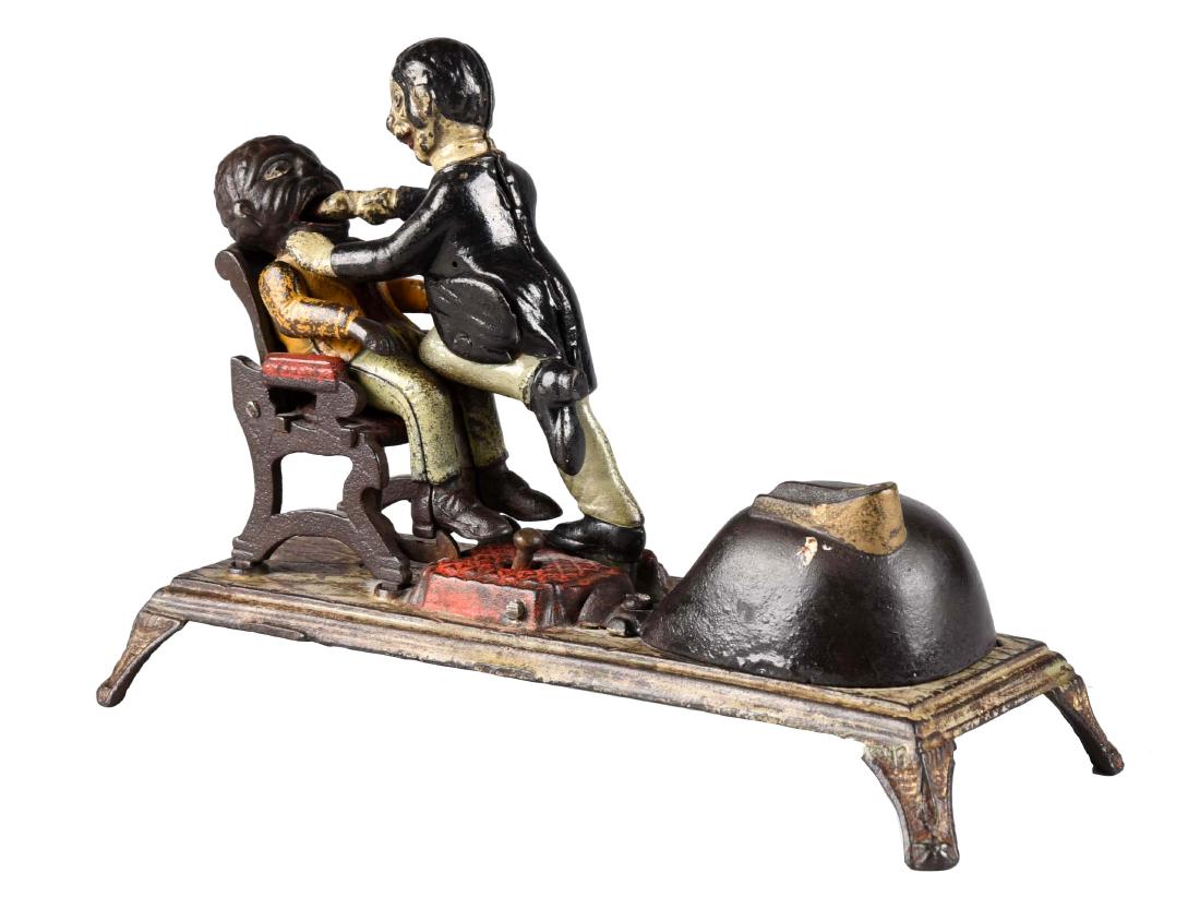 J. & E. Stevens Cast Iron Dentist Mechanical Bank. (1 of 3)